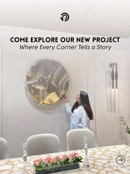 Here I am, adding the final touches to the dining area at The Aura House. That last piece of art or decor is what makes a space feel complete and truly personal.