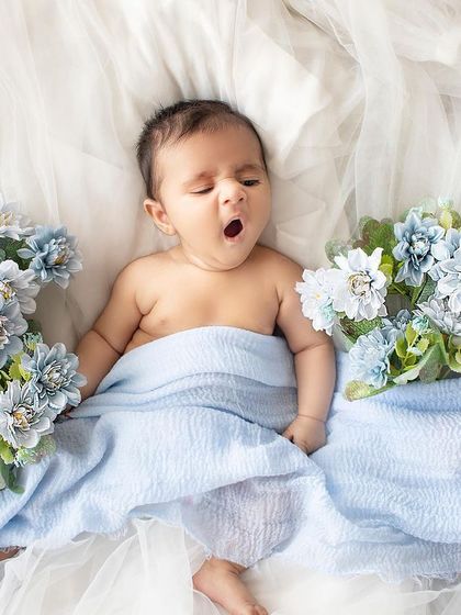 Capturing the unexpected moments. This little one was caught in the middle of a big yawn, making for an adorable and real photo.