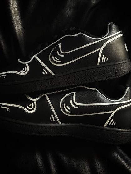 A pair shot of the cartoon-style Nike Ebernons.