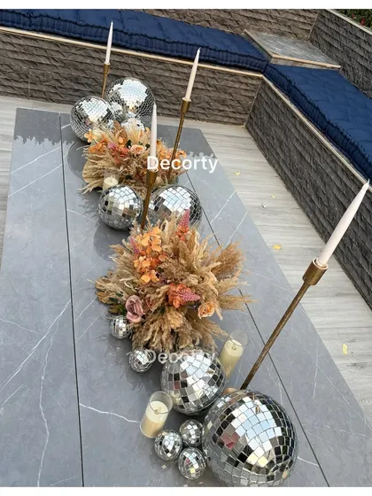 Another view of the stunning disco ball table runner, a unique and memorable decor choice for a modern party.