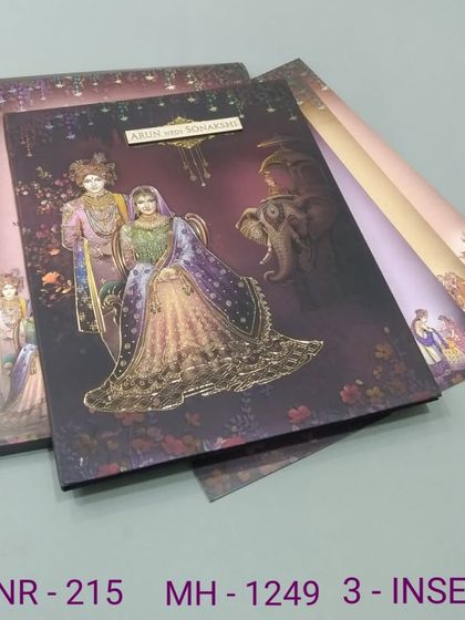 A dramatic invitation with a royal couple against a deep purple, starlit sky. The gold foil and elephant motifs add to the majestic theme of this three-insert card set.
