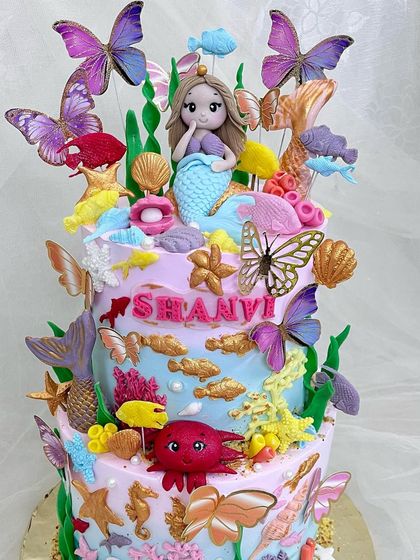 Another angle of the mermaid and butterfly cake, showing the variety of sea creatures and butterflies.