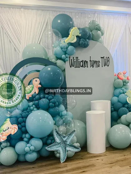 A wider view of the teal underwater theme, showing the layered backdrops and plinths.