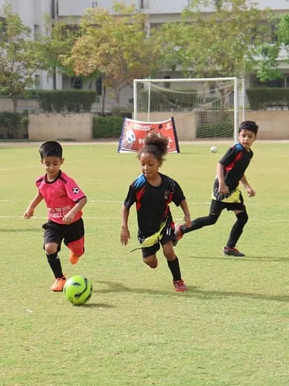 Young players chasing the ball with enthusiasm. Our league matches are filled with energy and a love for the game, creating a positive and exciting environment.