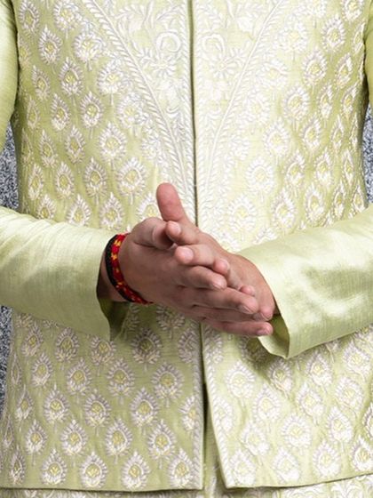 A close-up of the intricate Resham embroidery on our mint green bundi set. The delicate, tonal threadwork creates a beautiful texture perfect for elegant occasions.