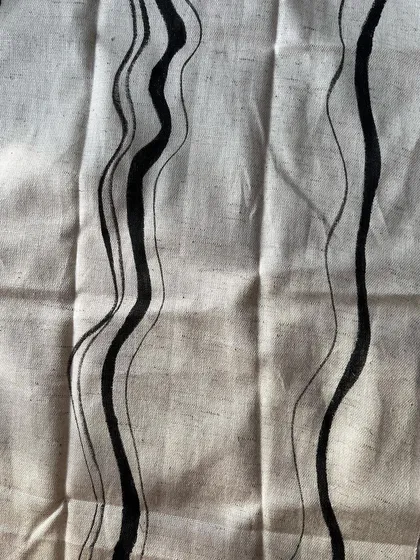 A close-up view of the hand-painted wavy line print. You can see the texture of the fabric and the subtle variations in the lines, which is the beauty of a handcrafted textile.
