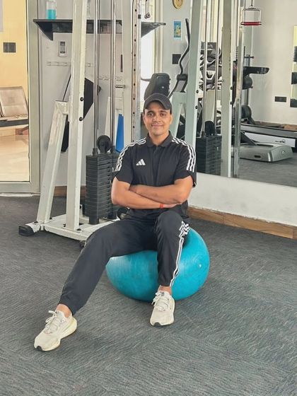 A relaxed pose on the stability ball, showcasing balance and control.