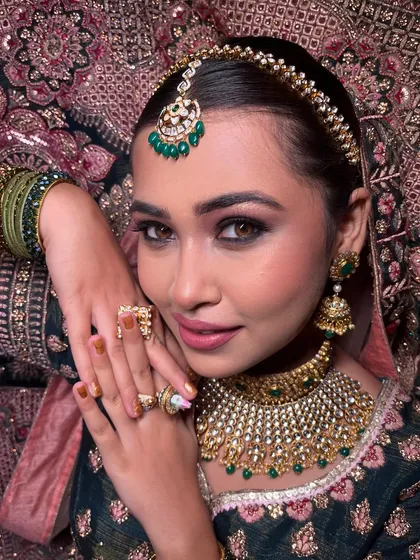 This shot highlights the intricate details of the makeup and jewelry, demonstrating the importance of a cohesive bridal look.