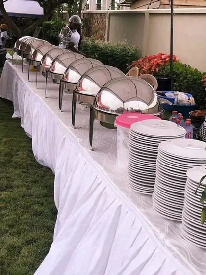 Our classic buffet setup is perfect for any large gathering or wedding. We provide everything from chafing dishes to keep food warm, clean table skirting, and stacks of plates, ensuring a professional and seamless dining experience for your guests.