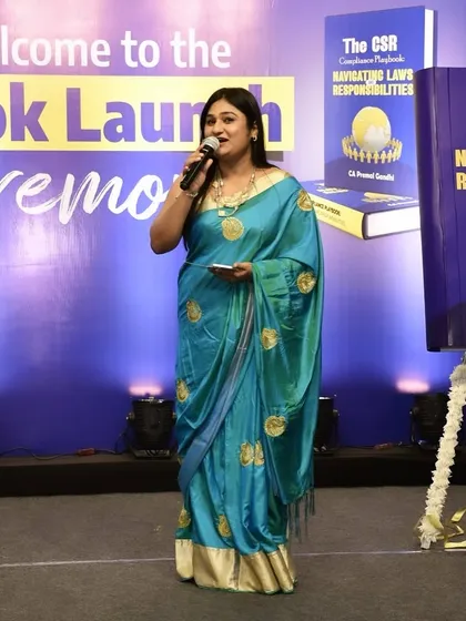 In action on stage during the book launch ceremony. I ensure that the significance of the launch is communicated effectively.