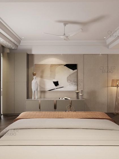 Transform your bedroom into a luxurious haven with this master suite. This view shows the media unit and a comfortable seating area, with dark wood flooring adding warmth and richness.