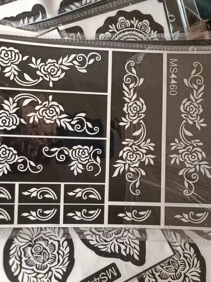 This sheet offers beautiful floral vine designs for fingers or as bracelet-style patterns. Just stick, apply henna, and peel for a perfect design.