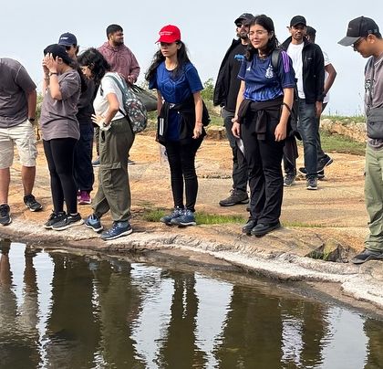 Our group exploring the small ponds and unique rock formations on the Kaiwara Hills trek.
