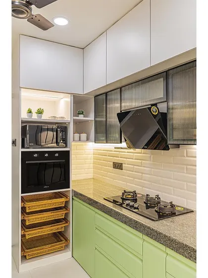 The appliance garage with a built-in oven and microwave, along with wicker baskets for vegetable storage, demonstrates our commitment to smart and organized kitchen design.