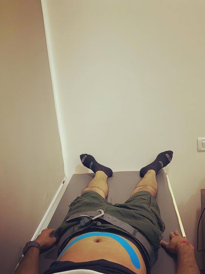 Kinesio taping can be used on various parts of the body. This application on the abdomen helps provide proprioceptive feedback to improve core engagement.