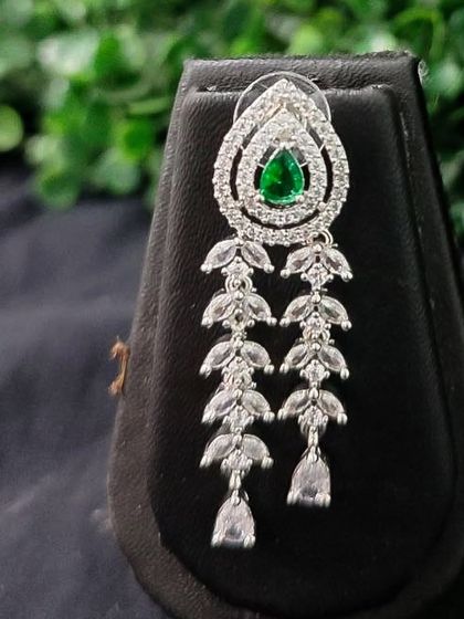 The matching dangling earring for the layered green AD set, designed to be elegant and eye-catching.