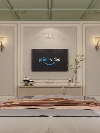 A view of the media wall in the green and beige bedroom. The design features simple wall paneling and a minimalist console, keeping the focus on the serene and calming color palette.