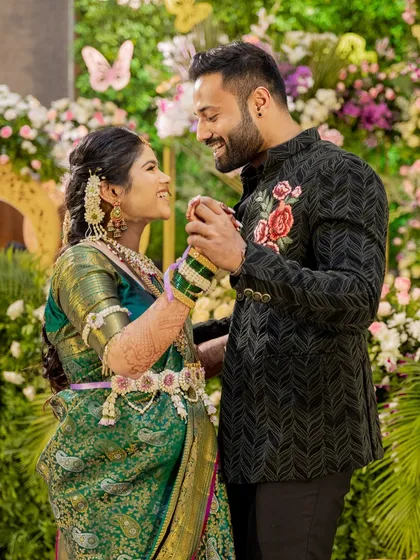 A beautiful moment between the expecting couple. Her floral jewellery adds a touch of romance and celebration to this special time.