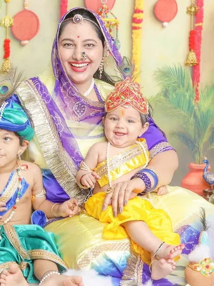 A mother with her two little Krishnas. I can easily accommodate siblings in these themed sessions to capture their lovely bond.