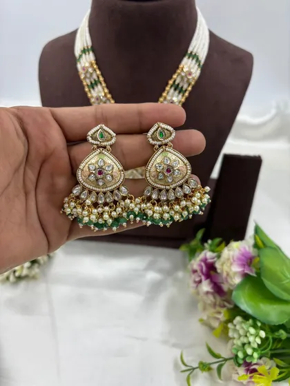 Another view of the 'Indira' set's earrings, this time with green bead accents.