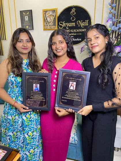 Two of my students celebrating their certification day. They are now professionally trained nail artists ready to take on clients.