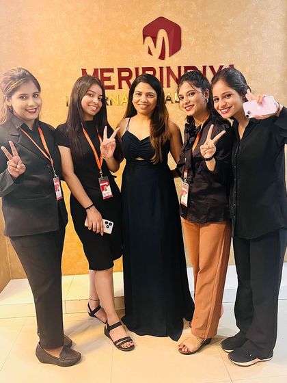 A group of our newly certified makeup artists celebrating their success with our director.