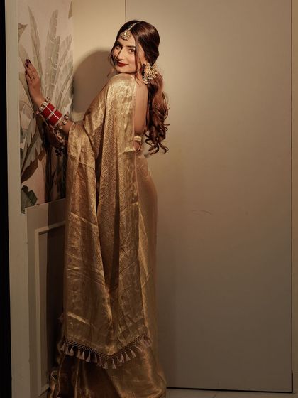 A full look at my golden saree. I believe in celebrating our traditions with style.