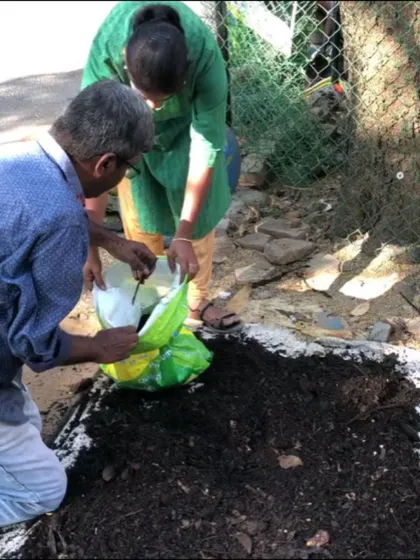 Teamwork makes the dream work. Here, volunteers are bagging the finished compost from a community project. This nutrient-rich soil amendment will now go on to nourish local gardens and farms.