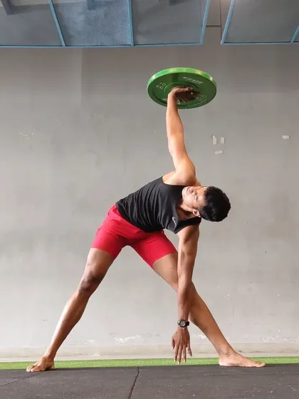 Control. This loaded windmill is an excellent exercise for building shoulder stability, thoracic mobility, and core control all at once.