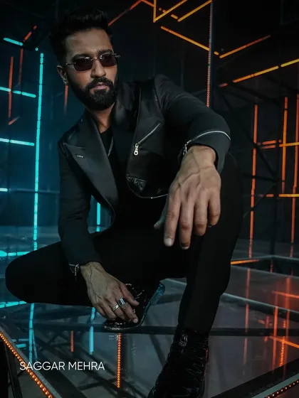 A powerful shot of Vicky Kaushal in my bespoke couture from the "Tauba Tauba" music video. The all-black look, sharp tailoring, and dramatic lighting all contribute to the commanding presence required for the screen.
