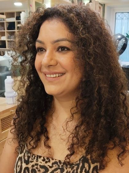 A close-up of her fabulous new look. The colour is rich and even, and her curls are perfectly defined and frizz-free.