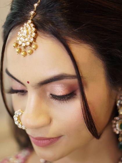 A soft and romantic eye look for Likitha. I used a wash of rose-gold shimmer across the lids to create a gentle, glamorous effect that enhanced her natural charm.