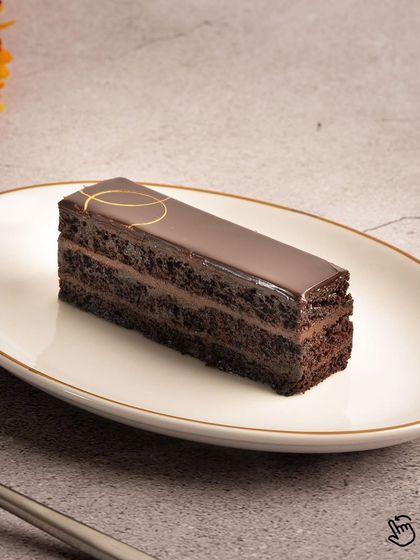 The same rich Chocolate Truffle Pastry, a perfect example of the decadent desserts you can order from Krust to satisfy your sweet tooth.