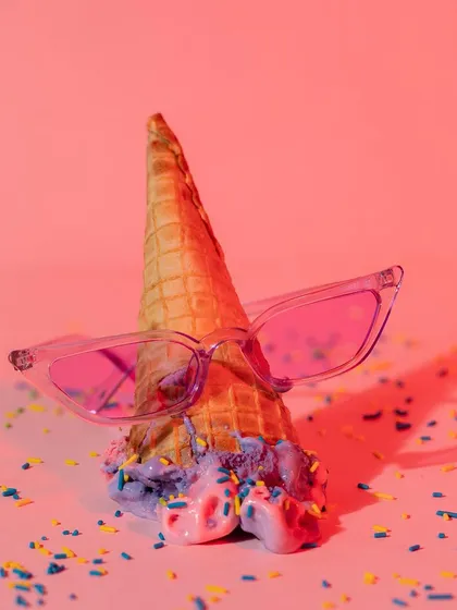 A playful and creative concept for sunglasses, using an ice cream cone and sprinkles. This fun, colorful approach is perfect for a youthful brand targeting a summer audience.