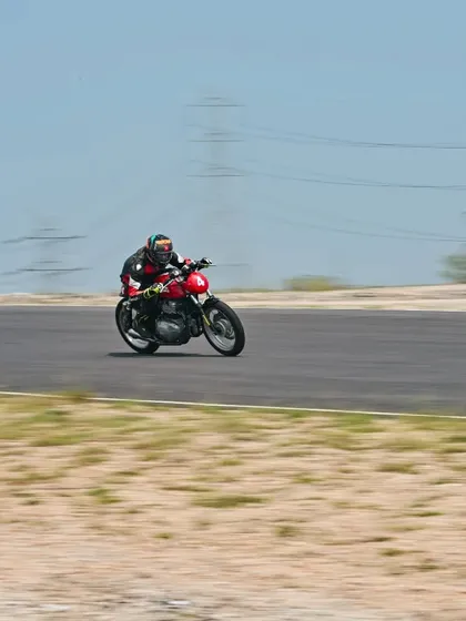 A motion-blur shot of a rider on the track, conveying a sense of speed.