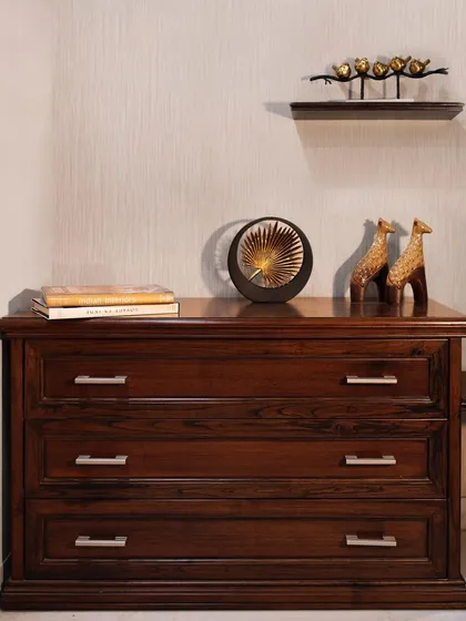 A wider view of the chest of drawers, where the modern hardware updates the classic furniture piece, making it feel current and stylish.
