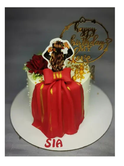 A special cake for a special someone. This eggless chocolate truffle cake features a beautiful red fondant dress design, perfect for an anniversary or romantic birthday.