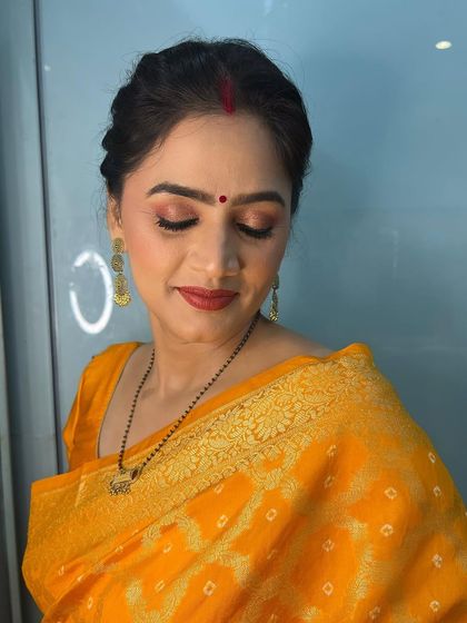 This grace and charm is never-ending. A beautiful client in a yellow saree, looking elegant and timeless.