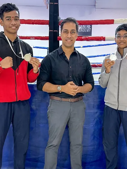 The brother-sister silver medal duo, Siddhesh and Riddhi, with our founder Mr. Devraj Das in the ring.