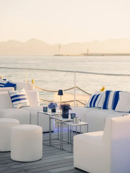 Another view of the serene seaside lounge, designed for guests to relax and enjoy the breathtaking views of the French Riviera at sunset.