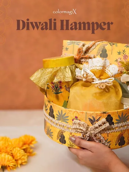 Our adorable mini hampers are perfect for spreading Diwali joy. This charming yellow round box is curated with festive treats and stylish details, making it a sweet and thoughtful gift.