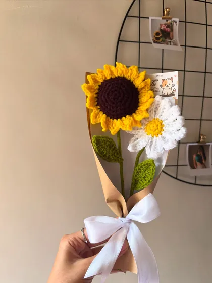 A sweet and simple bouquet combining a single sunflower and a daisy, showing how different flowers can be mixed and matched.