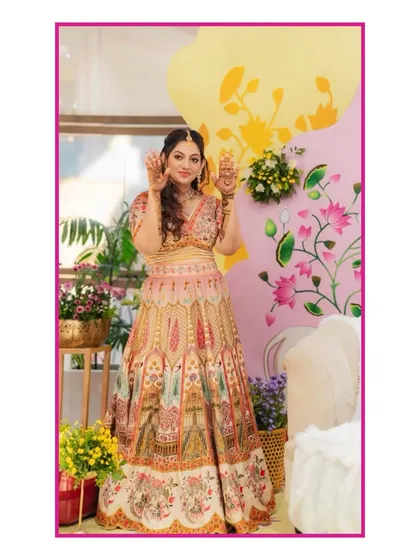 The beautiful bride at her pastel-themed Mehendi. The decor featured soft floral arrangements and a sunlit vibe, creating the perfect setting for her henna day.