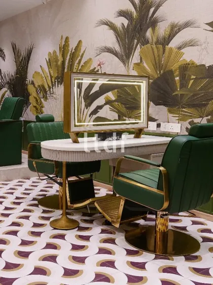 A lush escape within the salon, where bold patterns meet biophilic beauty. This station celebrates self-care in style, combining earthy greens, tropical motifs, and luxe gold accents to craft an immersive and glamorous grooming experience.
