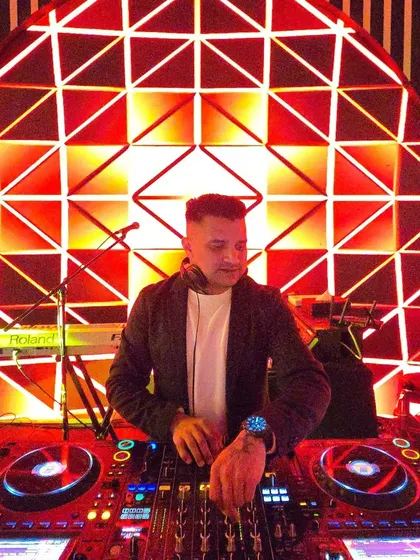 At the console for a spectacular 60th birthday party in Dubai. The red geometric background created a bold and modern look for this milestone celebration.