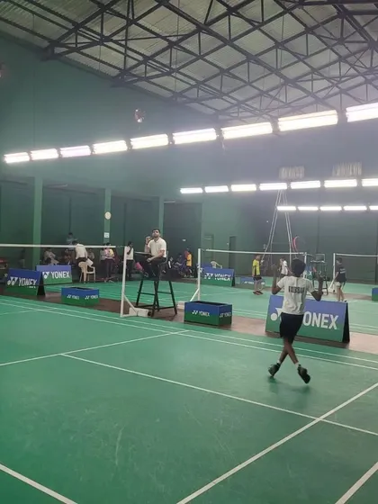 A player prepares to serve during a competitive match at the state championship held at our HSR Club facility.
