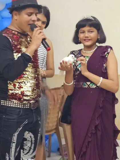 Another shot from the Andheri East party, where the birthday girl is the star of the show, presenting the magic dove to the audience.