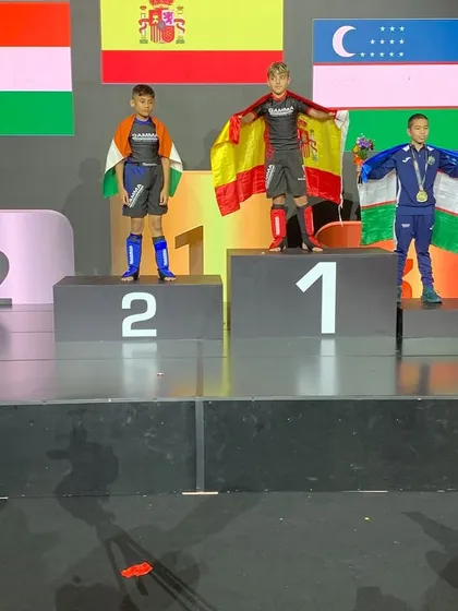 Shivam Saha on the podium, draped in the Indian flag, after securing his silver medal. He stood against the best in the world and proved his mettle.