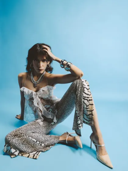 A full-length shot from the 'Wild Glamour' series, showing the mix of animal prints and textures. The pose is confident and powerful, embodying the theme.
