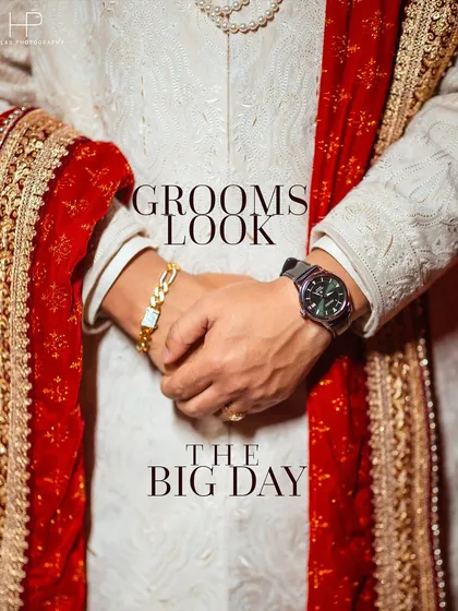 A detail-oriented shot focusing on the groom's look. This image highlights the texture of his white sherwani, his watch, and bracelet, capturing the small but significant elements of his wedding day style.